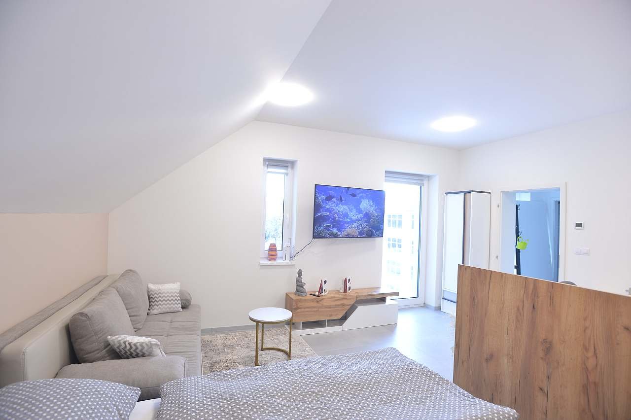 Apartmán Relax obývací pokoj s postelí